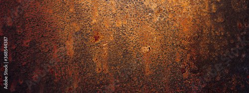 Empty rusty corrosion and oxidized background, panorama, banner. Grunge rusted metal texture. Worn metallic iron wall. photo
