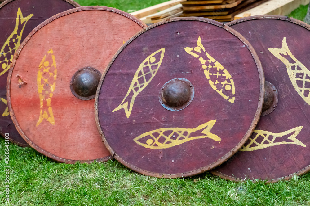 Naklejka premium set of traditional wooden shields, round red patterned fish, disposable for ostentatious fights