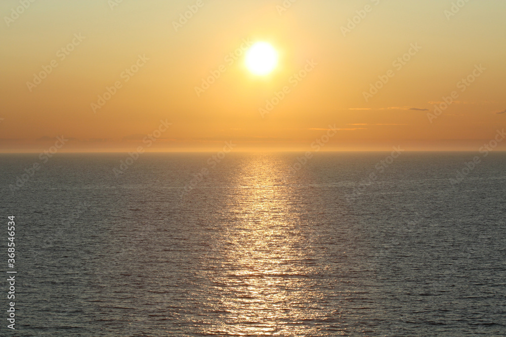Midnight sun creating lens flare in the arctic circle, Norwegian Sea, Norway