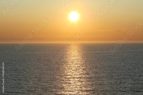 Midnight sun creating lens flare in the arctic circle  Norwegian Sea  Norway