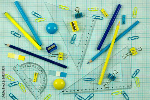 background with a set of yellow and blue office supplies. Education, school and study concept. The new school year. back to school. knowledge day