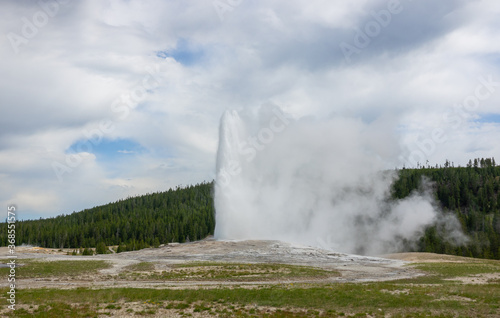 Amazing view of the Old Faithful Geyser at Yellowstone, Wyoming, USA