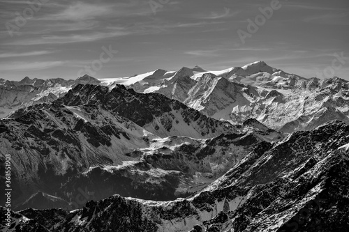 Mt. Grossvenediger Hohe Tauern mountain range, and Mt. Gaisstein belonging to Kitzbuehel alps in front. Austria, alps. monochrome