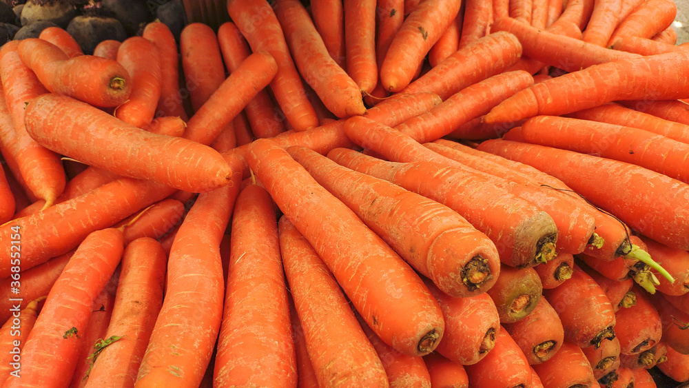 Portion of carrots in supermarket display. Portion of carrots in supermarket display.