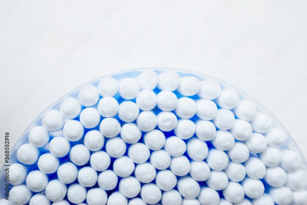 Cotton sticks ear blue plastic on a white background. Personal hygiene and care. Cosmetology and medicine. Cotton sticks ear blue plastic on a white background. Personal hygiene and care. Cosmetology and medicine.