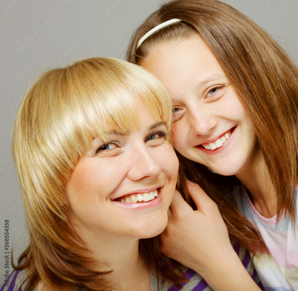 little girl with her happy mom isolated on white little girl with her happy mom isolated on white