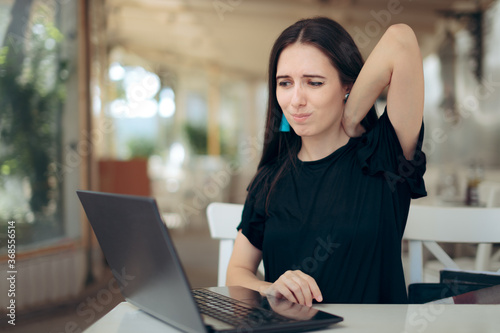 Woman Having Neck Pain From Spending time at the Computer
