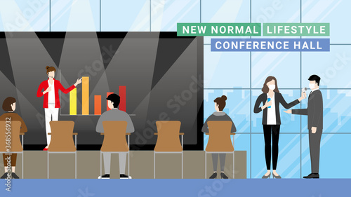 New normal lifestyle in the conference hall. Business presentation. Social Distancing by people sitting apart and listen to the speaker. Thermal checkpoint and hand sanitizing at the entrance.