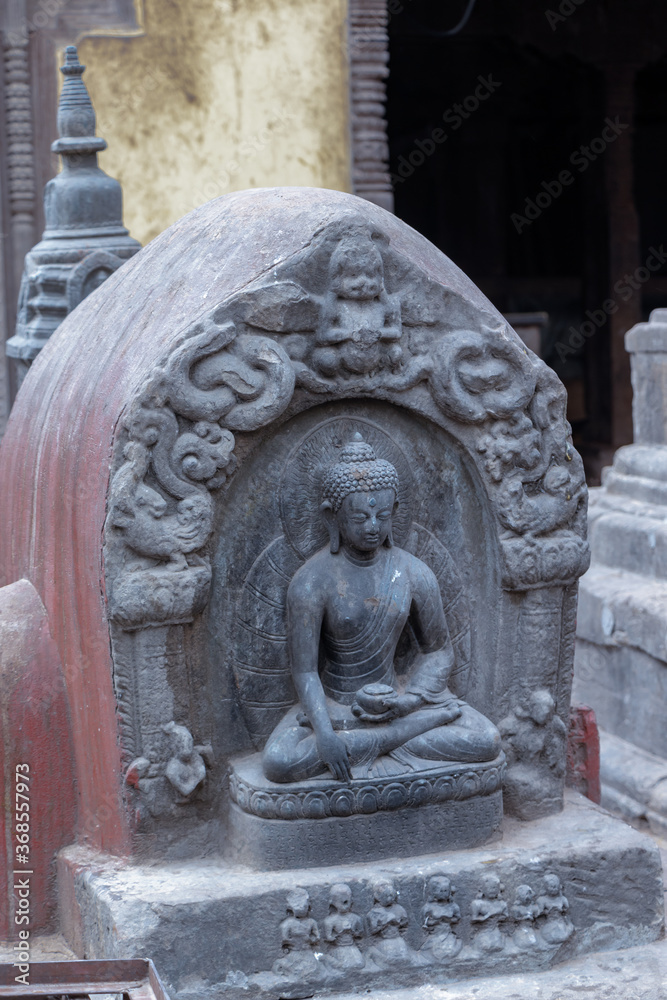 The statue of Buddha beside the Swayambhunath Stupa, Kathmandu, Nepal the World Heritage site declared by UNESCO