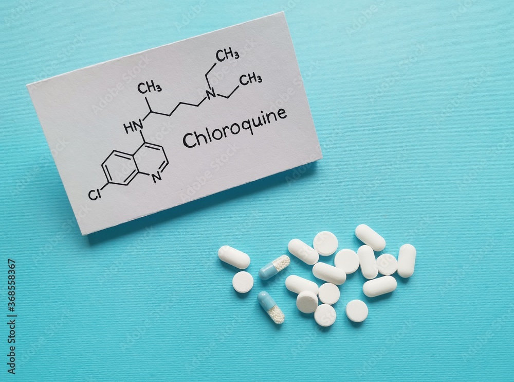 Structural chemical formula of chloroquine molecule with pills and
