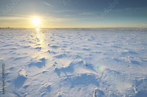 Winter landscape. Ice on water surface.