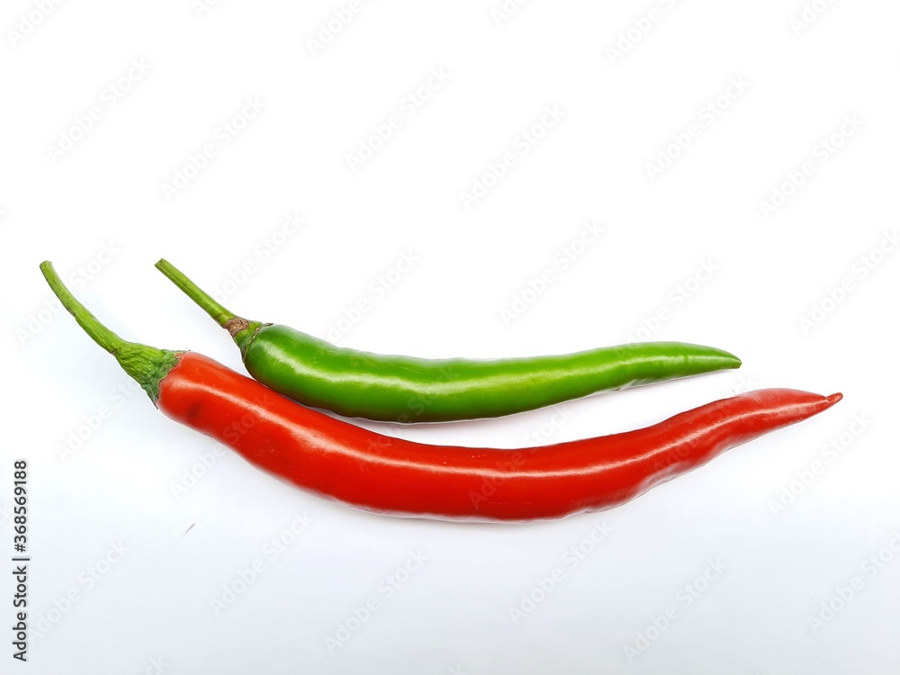 Fresh peppers with green and red on white