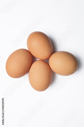 Four isolated chicken eggs