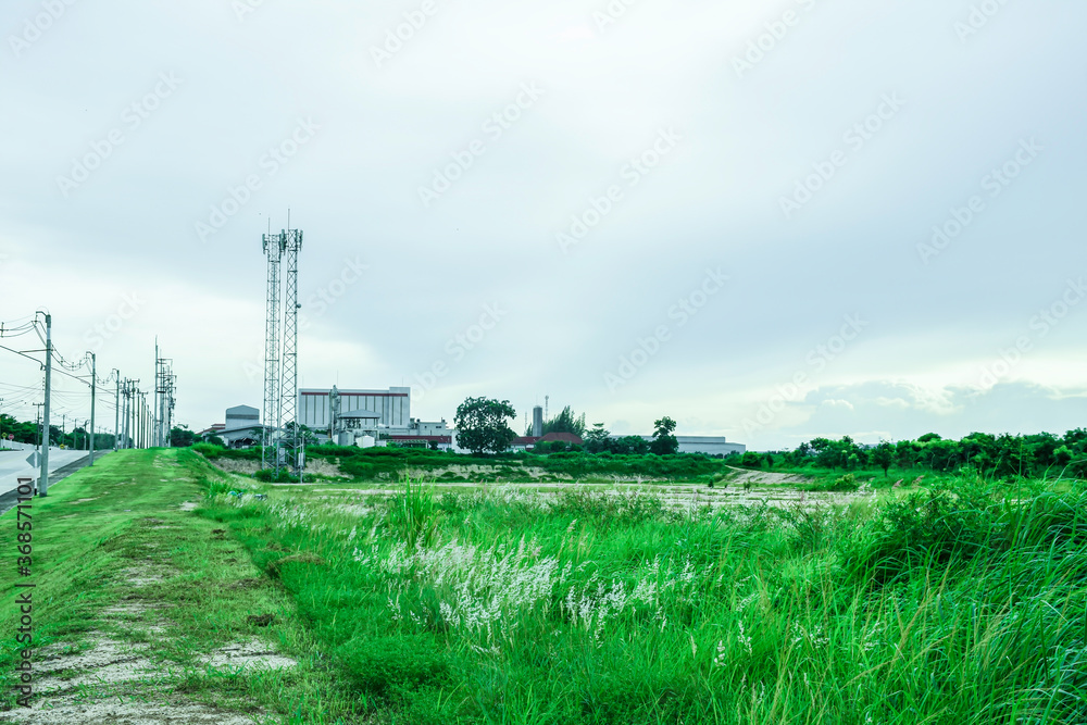 Green fields with modern factory buidling for green industry concept