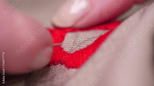 Wallpaper Mural seamstress closeup woman hands sewing with needle macro slow motion Torontodigital.ca