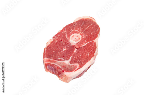 Raw piece of lamb leg in white background