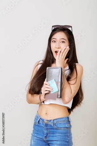 woman holding wallet and credit card