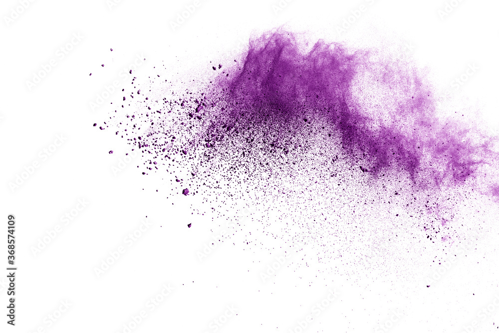 Freeze motion of purple color powder exploding on white background. Freeze motion of purple color powder exploding on white background.