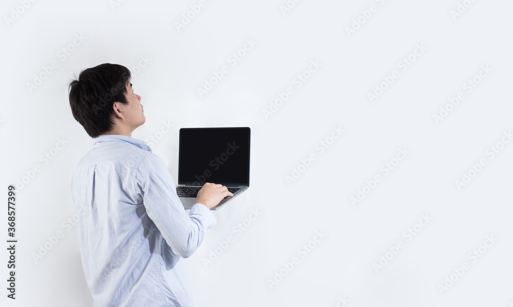The man looks at the screen of rising capital The man looks at the screen of rising capital