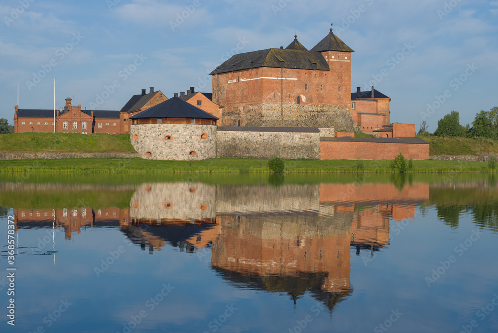 Ancient Hameenlinna fortress with  reflection close-upon a sunny July morning. Finland