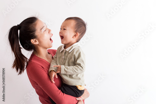 The mother checked the baby's oral health