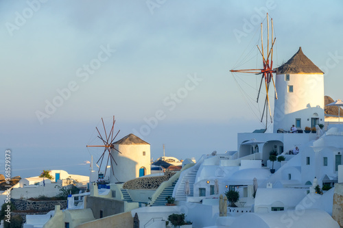 Windmills and White Houses on a Mountainside in Santorini