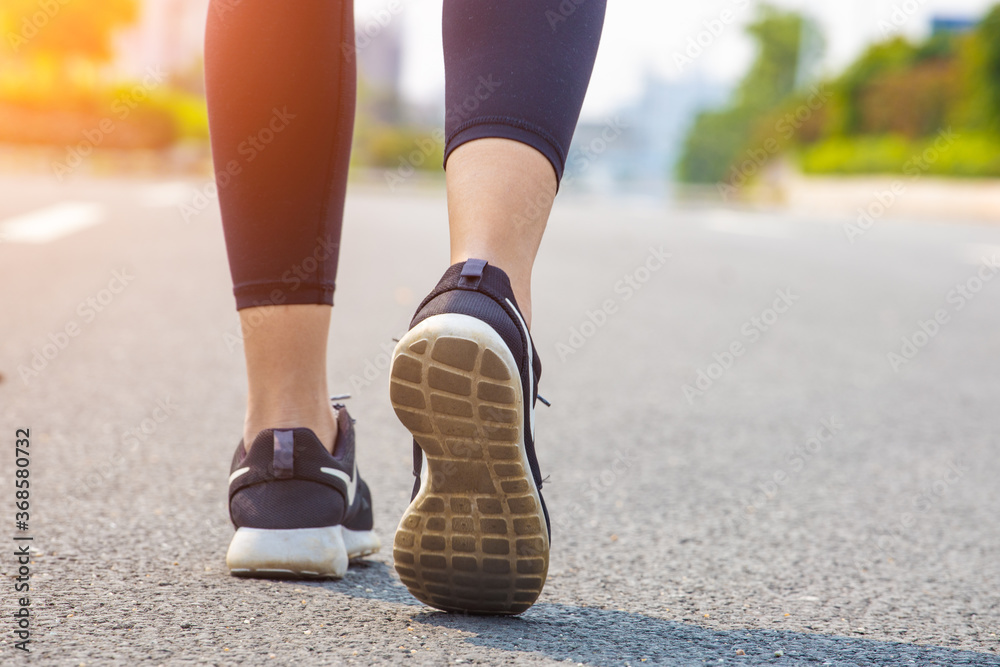 Young women run for fitness in the morning Young women run for fitness in the morning