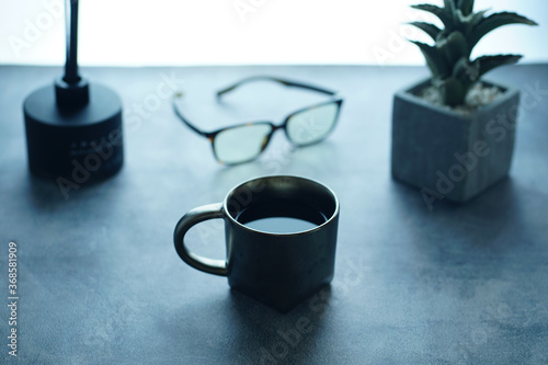 A glass of coffee in the office table