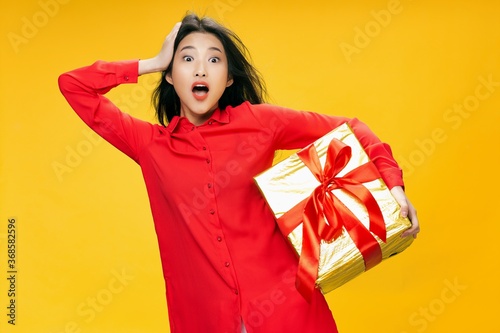 Birthday present surprised woman surprise red shirt holiday 