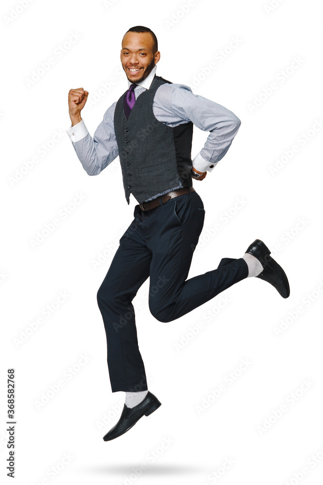 happy young african businessman jumping high isolated on white background