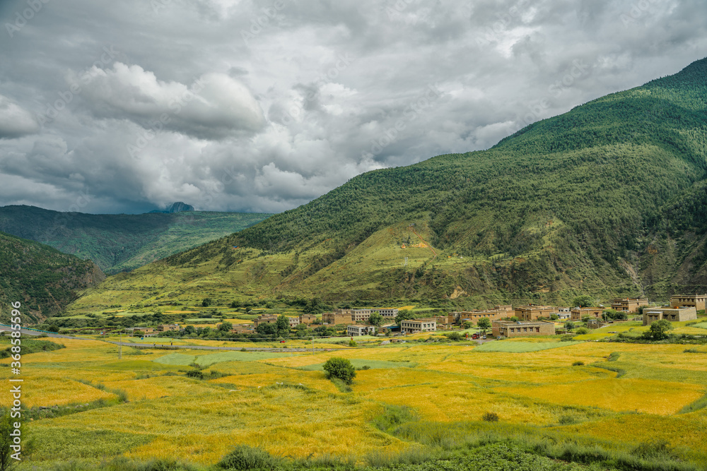 A Tibetan village in the valley of mountains.
