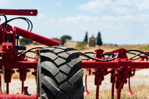 Modern agricultural machinery and equipment. Industrial details in Tuscany landscape, Italy