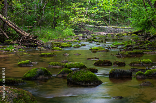 A small rocky river in spring Taken in Latvia  Raunis river