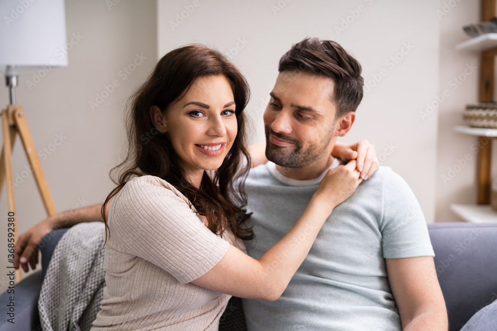 Sitted Happy Man And Woman On Sofa Or Couch Sitted Happy Man And Woman On Sofa Or Couch