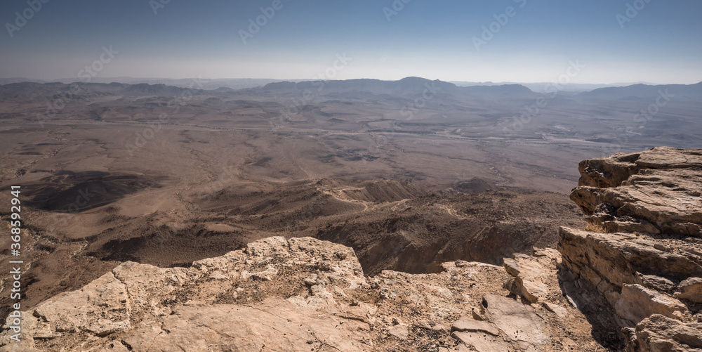 The bottom of Ramon Crater (Makhtesh Ramon), the largest in the world, as seen from the high northern rim, Ramon Nature reserve, Mitzpe Ramon, Negev desert, Beersheba, Israel.
