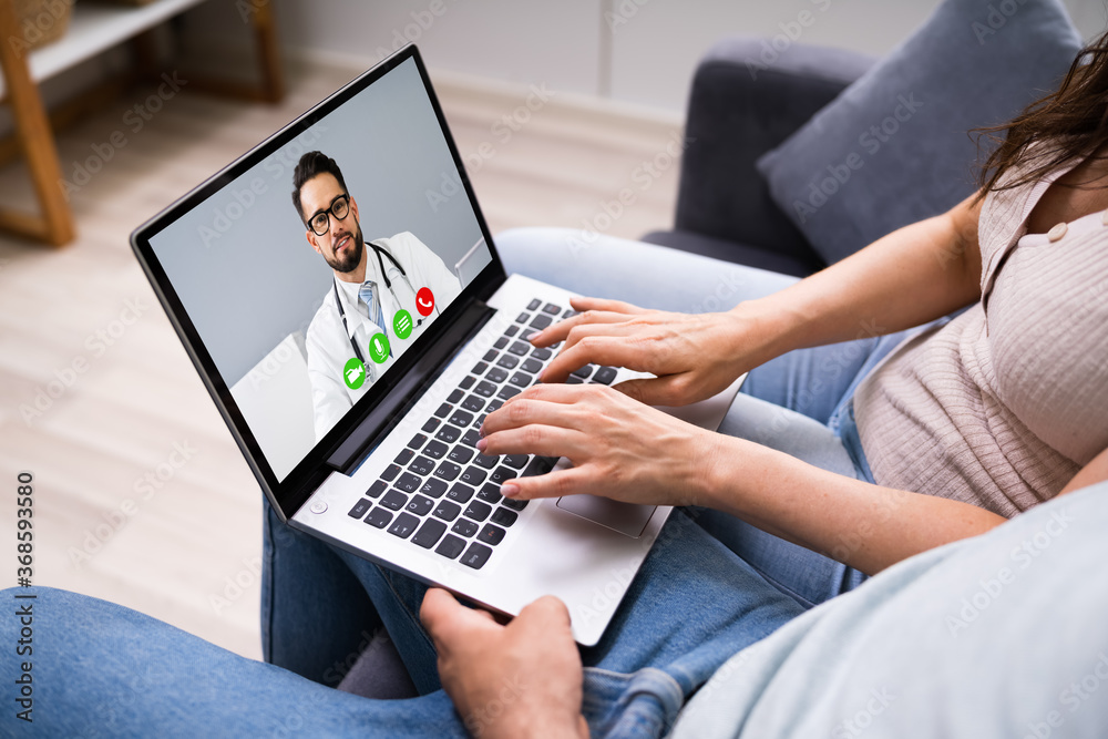 Fototapeta premium Pregnant Couple In Online Video Conference Call