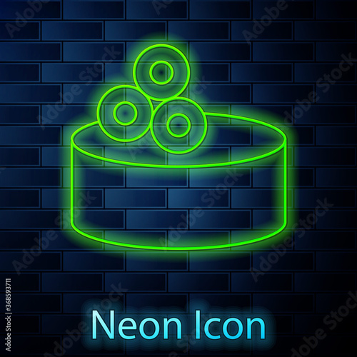 Glowing neon line Tin can with caviar icon isolated on brick wall background. Vector..