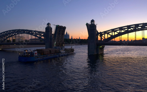 The Bolsheokhtinsky Bridge is a beautiful drawbridge across the Neva River in St. Petersburg. © chekart