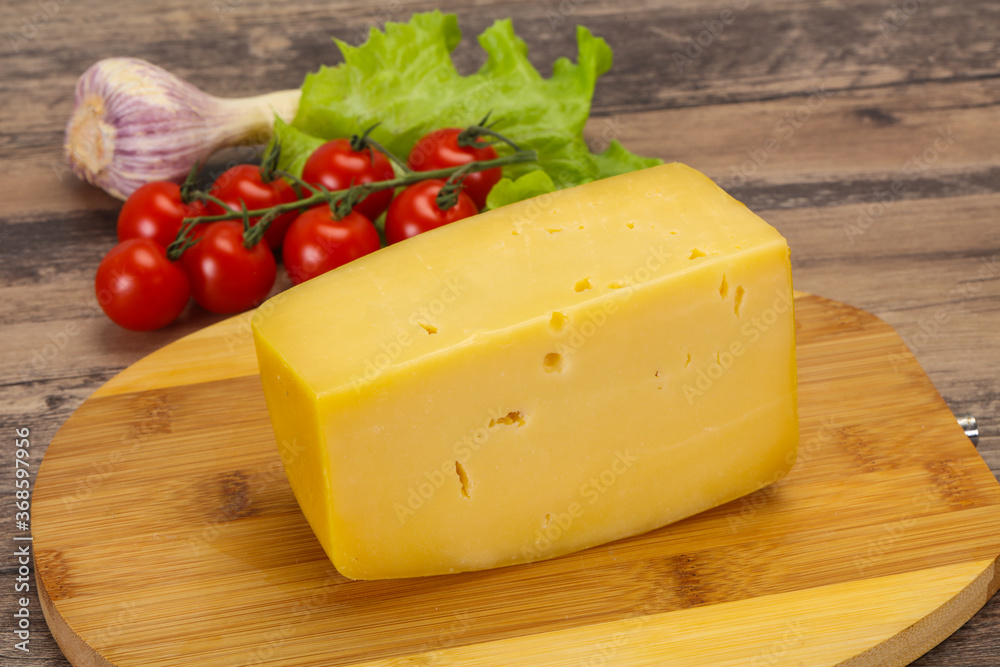 Hard yellow tasty cheese brick Hard yellow tasty cheese brick
