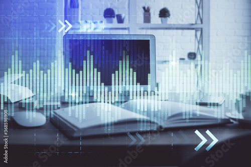 Forex market chart hologram and personal computer background. Double exposure. Concept of investment.