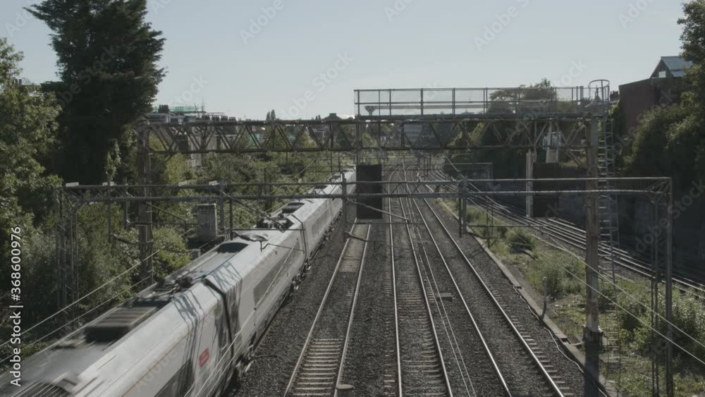 High speed train passing under bridge