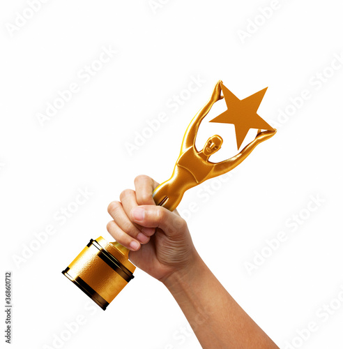 hand holding a gold trphy