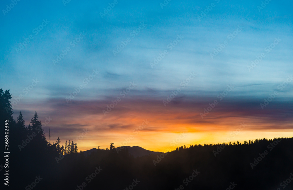 Fototapeta premium mountain with sunset cloudy sky.