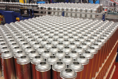 Silver aerosol cans in aerosol manufacturing business photo