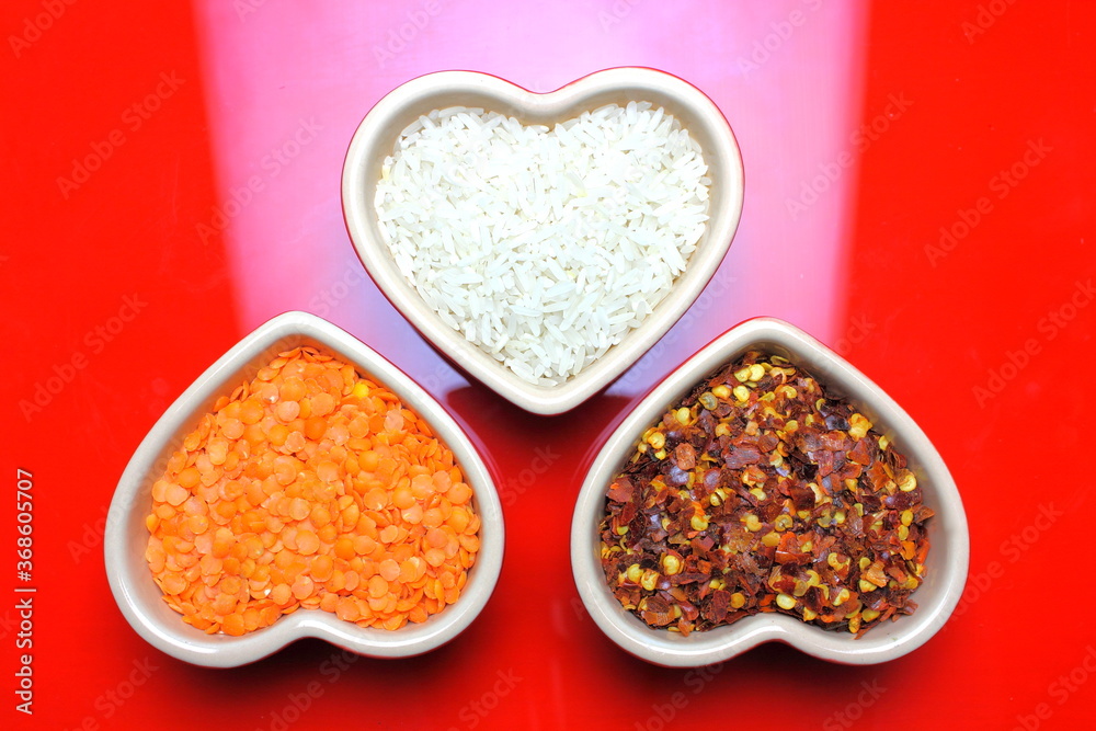 rice lentils and chilli in heart shaped dishes rice lentils and chilli in heart shaped dishes