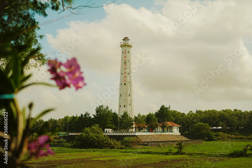 Beautiful white lighthouse on Ketawang Beach