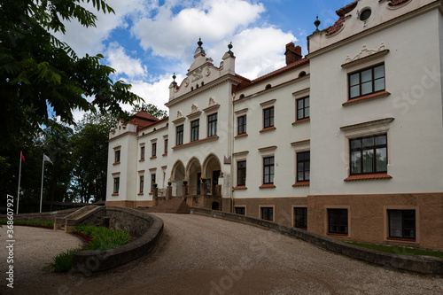 Rokiskis manor and park in sunny summer day