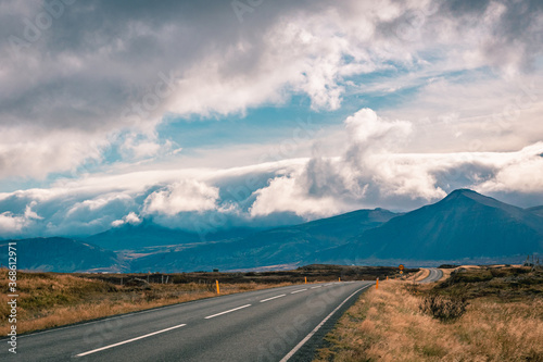 Icelandic road and snowcapped mountains