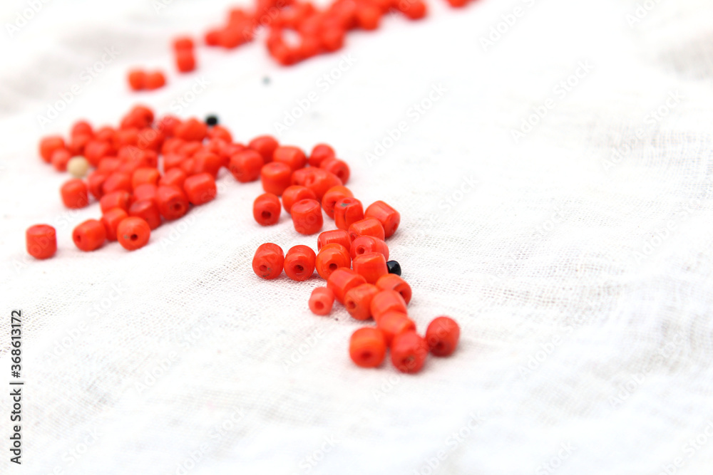 some red and black stone pearl isolated on white background some red and black stone pearl isolated on white background