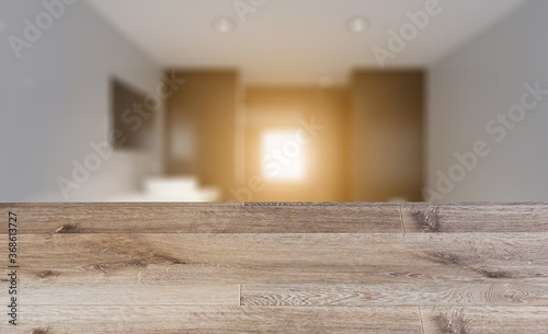 blurred interior on a wooden table background.. Sunset.